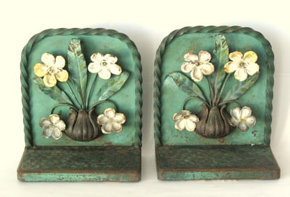 Antique cast iron stylized flowers bookends.