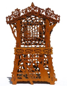 An elaborate fretwork bird cage with great decoration