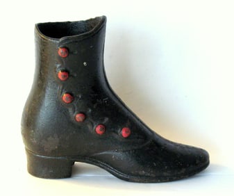 Antique cast iron country store mannequin shoe display.