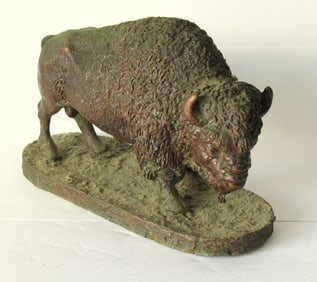 Antique cast metal sculpture of an American Bison.