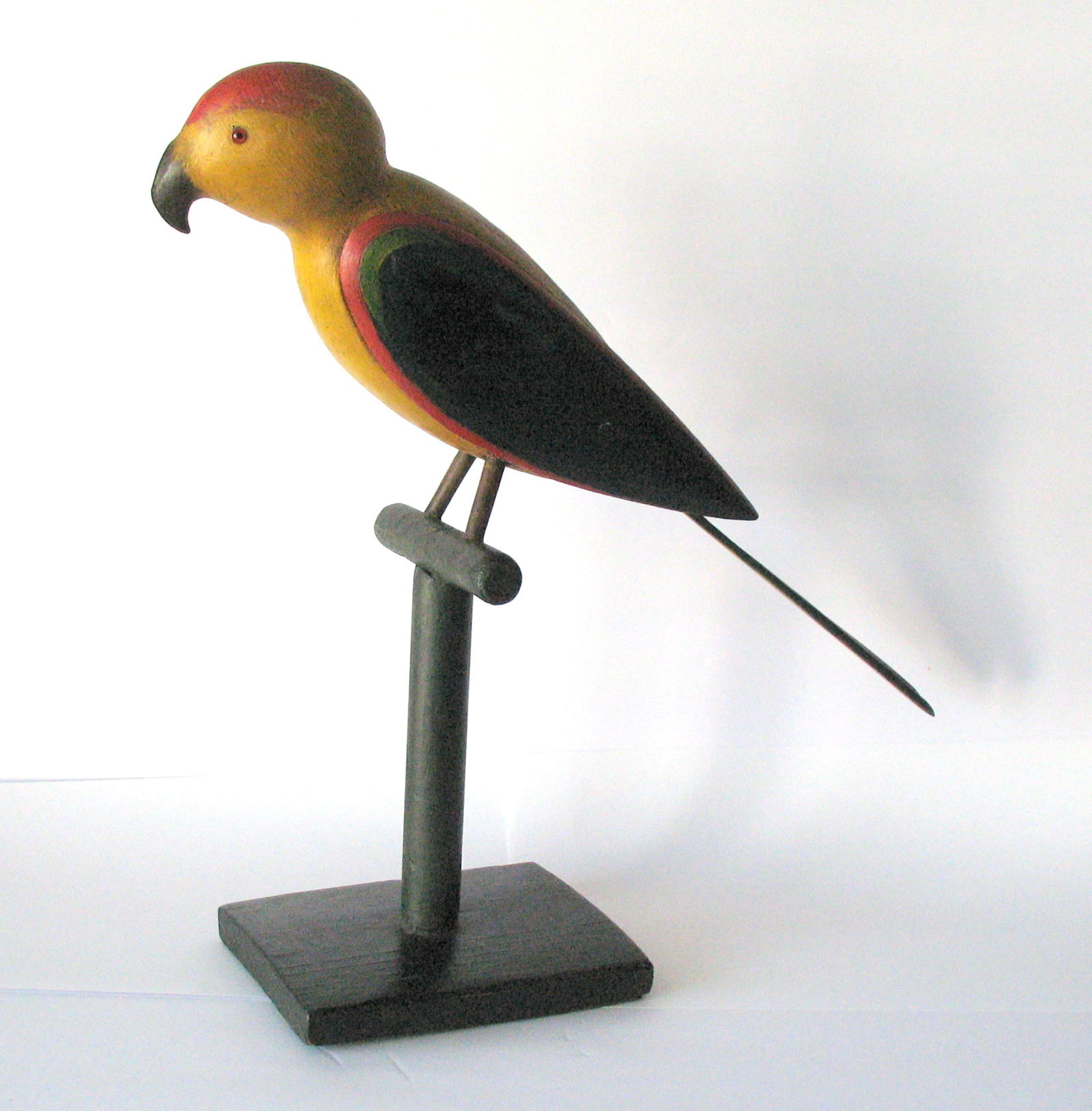 Vintage colorful folk art wood carved parrot on it's perch. (1 of 5)