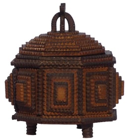 A small octagonal tramp art box