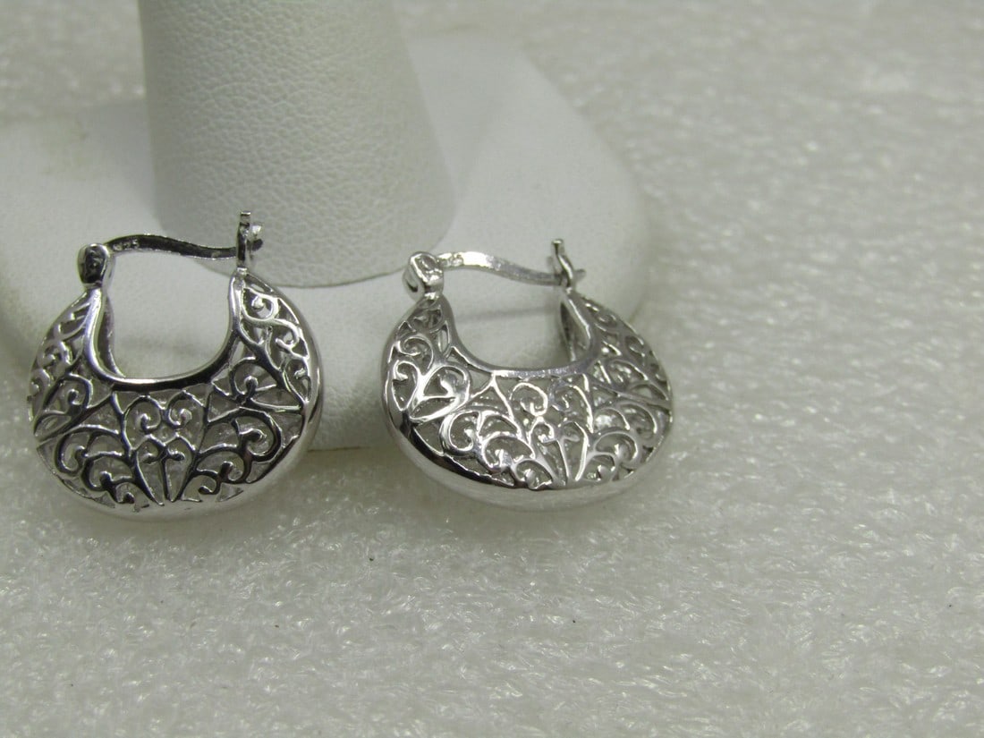 Sterling Rhodium Scrolled Hoop Earrings, Pierced, 3/4": Sterling Rhodium Scrolled Hoop Earrings, Pierced, 3/4". They have a hinged locking post and are appx. 4.5mm thick. They have a somewhat basket look. Very good condition. Not signed by the maker. Weigh