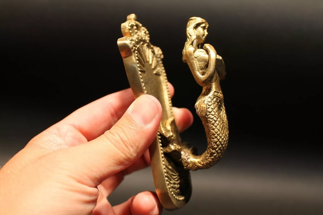 Brass Mermaid Wall Hook: (1) Hook 4 3/4" Tall.. 2 1/8" Wide 2" Extension Add a Touch of Nautical Charm with the Antique Vintage Style Wall Hook Brass Mermaid The Brass Mermaid Antique Vintage Style Wall Hook is a beautiful an