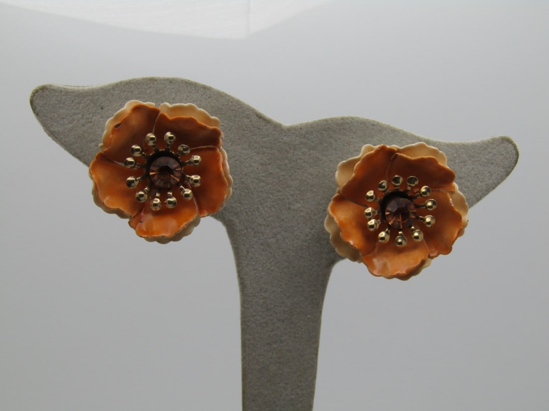 Vintage Coro Orange & Cream Clip Earrings, Rhinestone, 1940's-1950's: Vintage Coro Orange & Cream Clip Earrings, Rhinestone, 1940's-1950's. 1" across with two tiers of enameled petals, lower is a pale orange cream and the upper is slightly darker with a center orange fa