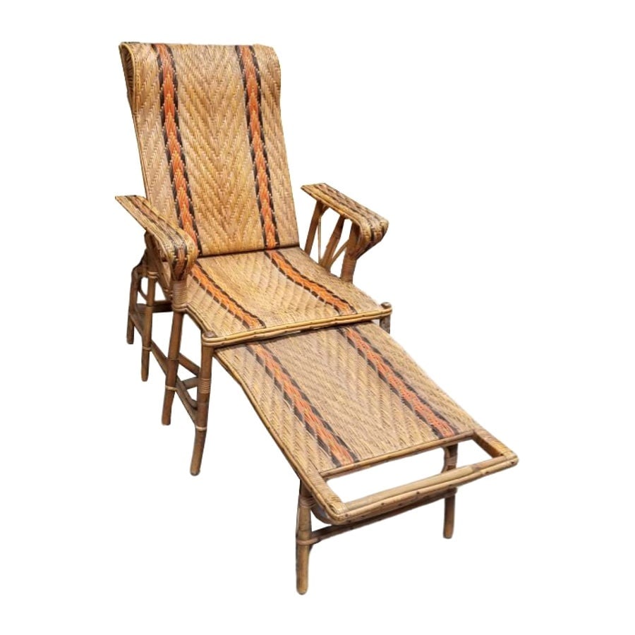 Restored Rattan Wicker French Art Deco Adjustable Chaise Lounge: Restored rattan wicker French Art Deco Lounge chair that features an extendible ottoman that is attached, and an adjustable back to adjust back height. Experience timeless elegance with our meticulous