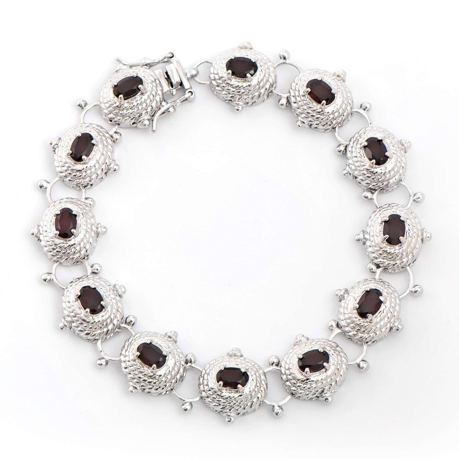 6.05 ctw Garnet Rhodium Plated Designer Antique Style Bracelet 8.1 in: Title: 6.05 ctw Garnet Rhodium Plated Designer Antique Style Bracelet 8.1 in Stone 1: Garnet Color: Brown Shape: Oval Size: 6x4 Quantity: 12 CTW: 6.05 Plating Material: Rhodium Primary Material: Base 