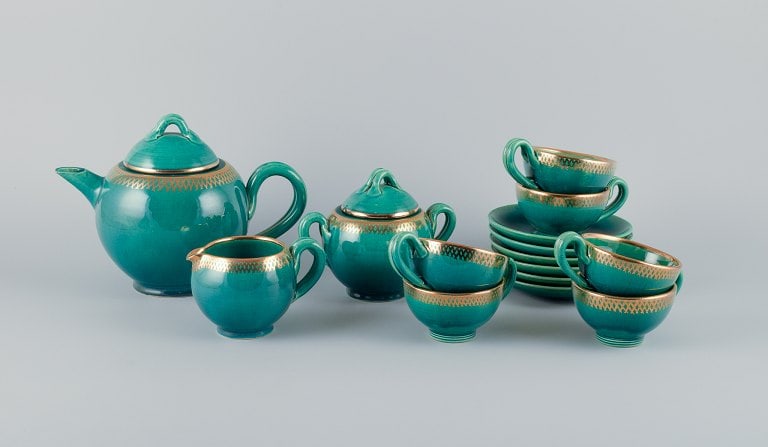 Accolay, France, complete ceramic tea service for six people. Hand-decorated in green glaze with: Accolay, France, complete ceramic tea service for six people. Hand-decorated in green glaze with gold decoration. A total of 15 pieces. Mid-20th century. In excellent condition, tea pot with minor sma