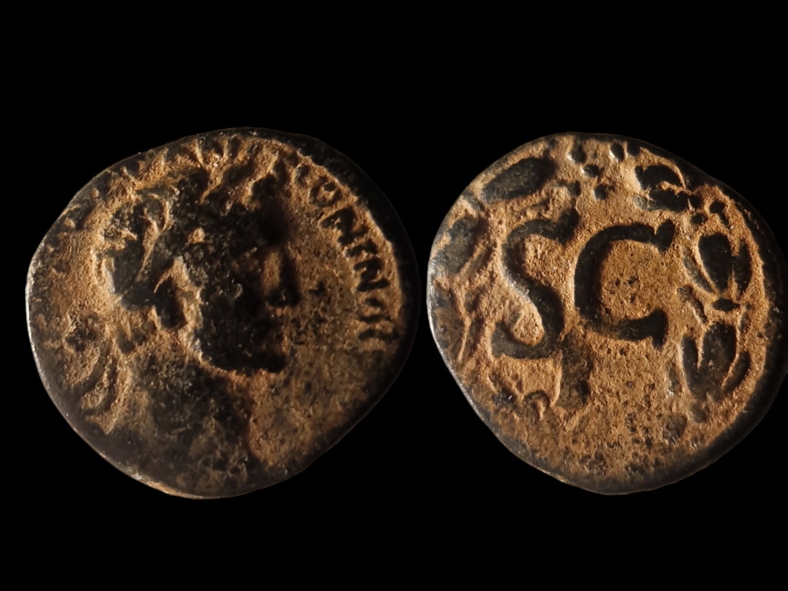 Roman Empire: Title: Roman Empire Description: Roman Empire. AE15 of Emperor Trajan (98-117 AD), minted in Antioch. Obverse: Laureate bust of Trajan facing right, with clear details. Reverse: Large 'SC' within a la