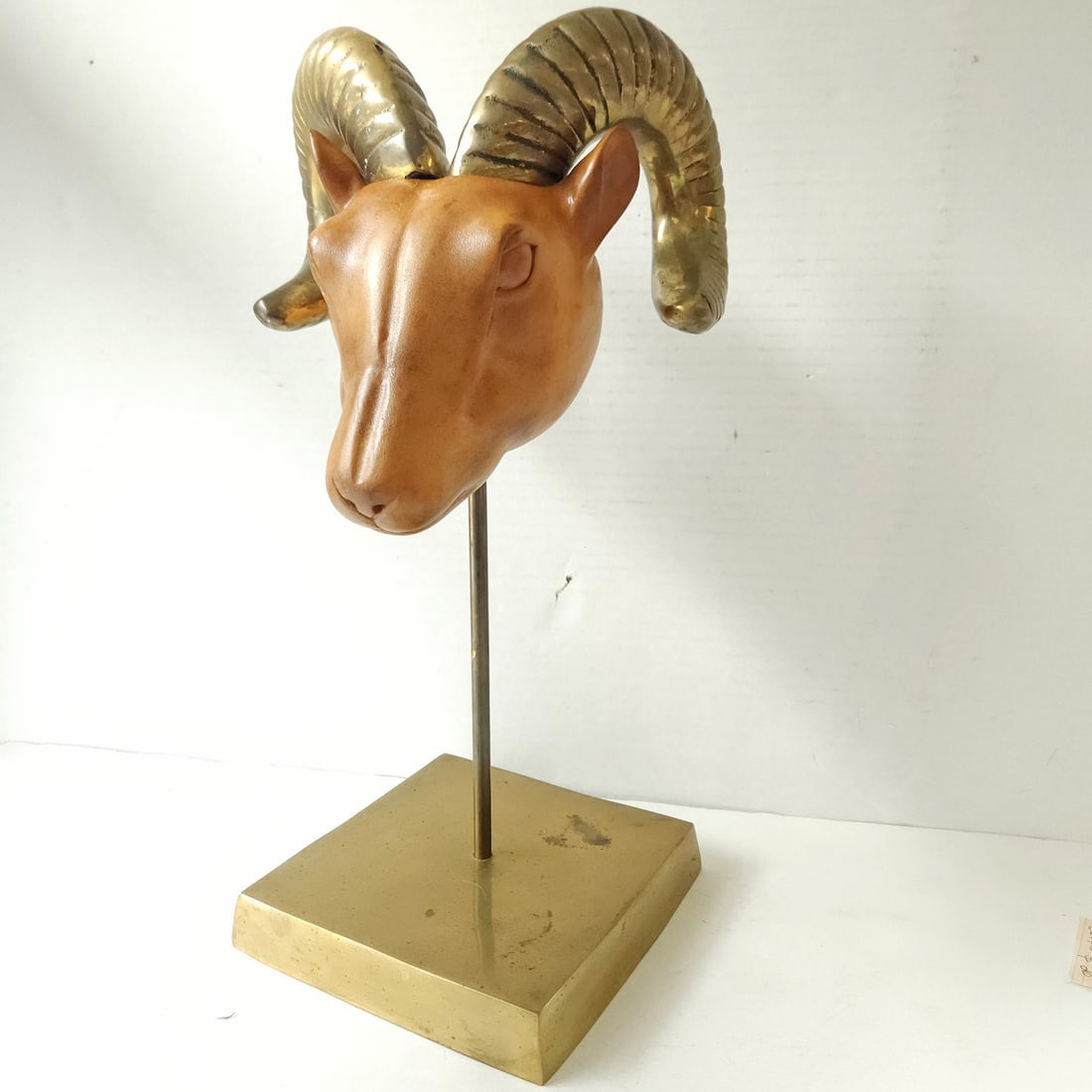1980's Dolbi Cashier Ram’s Head Brass & Wood Sculpture: Title: 1980's Dolbi Cashier Ram’s Head Brass & Wood Sculpture Description: 1980s Dolbi Cashier Wood and Brass Sheep/Ram’s Head mounted on rod and and brass base Pedestal. Made in Korea in 