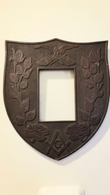 Fantastic carved frame, eagle and flag, Masonic motif, flowers on a vine.