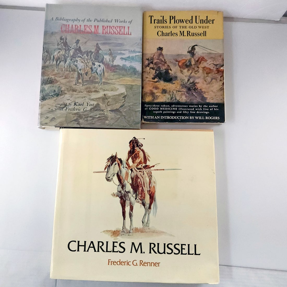 Nice collection of Charles M Russell Books: Title: Nice collection of Charles M Russell Books Description: Charles M. Russell Trails Plowed Under Stories of the Old West Hardcover 1st Edition 1927 with Dust jacket Charles M Russell Paintings, D