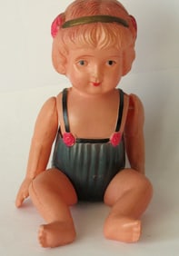 Antique articulated celluloid little girl toy.