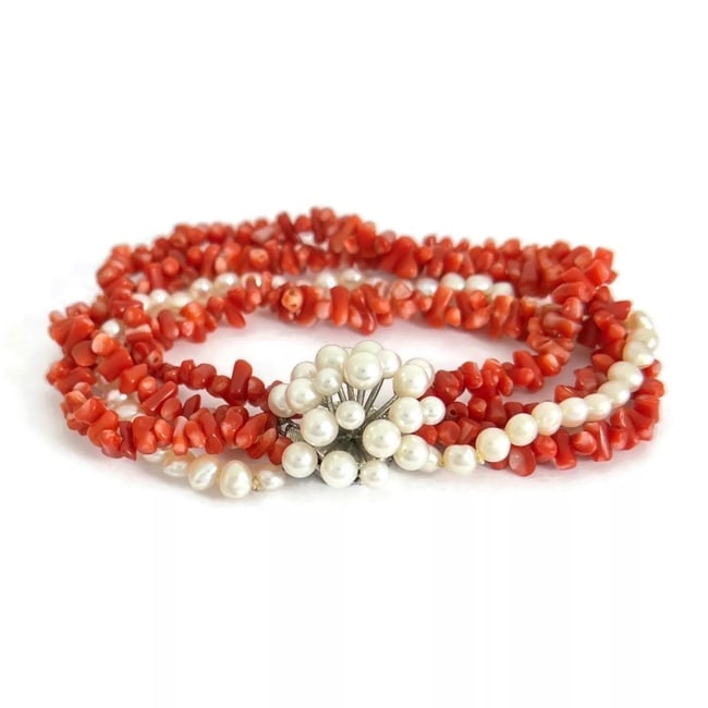 Vintage 1960's Coral Bead Pearl Twisted Multi Strand Bracelet, 33.53 Grams: Vintage 1960's Coral Bead Pearl Twisted Multi Strand Bracelet, 33.53 GramsThis is a lovely vintage necklace. Please let us know if you have any questions.Circa: 1960'sBeads: simulated coralPearls: fre