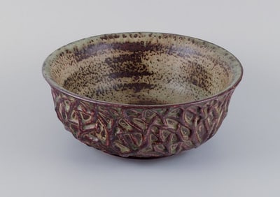 Axel Salto for Royal Copenhagen, large ceramic bowl designed with leaf patterns in relief.
