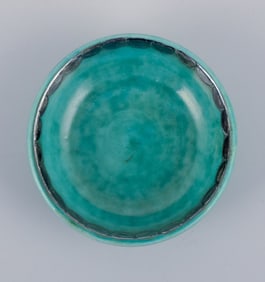 Wilhelm Kåge for Gustavsberg, a set of five small "Argenta" ceramic bowls. Green glaze with