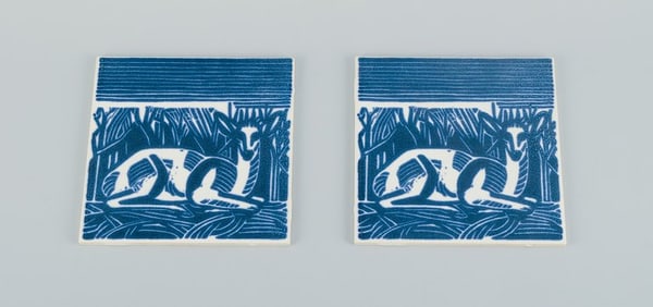 Axel Salto for Royal Copenhagen, two rare tiles. Motif of reclining deer. Mid 20th century.