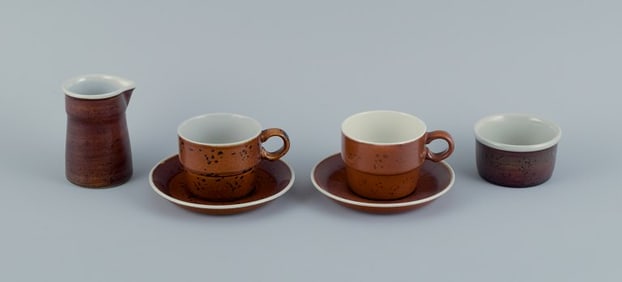 Stig Lindberg for Gustavsberg, COQ, two coffee cups with saucers, cream jug and sugar bowl.