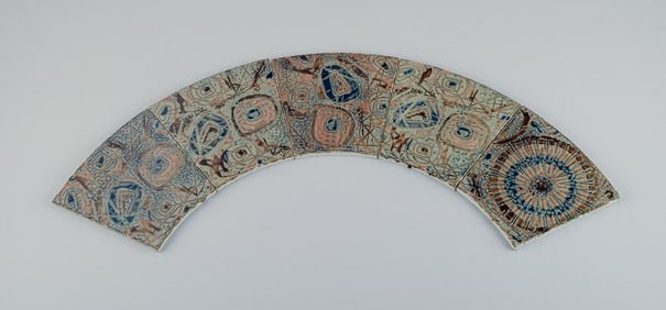 Royal Copenhagen, five Baca faience tiles with patterned glaze in brown, blue, green and sand