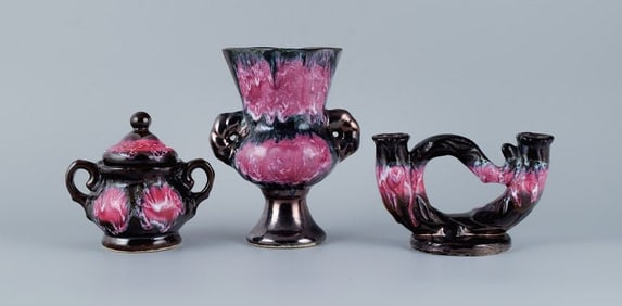 Valluris, France, Lidded bowl, two-armed candlestick and a vase.