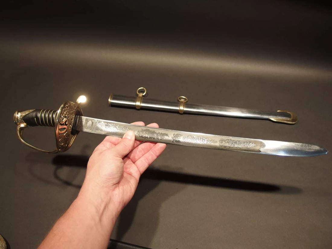 28" SMALL Union Civil War Staff Officer Sword: 26" Long with scabbard 28" 3" Grip 2 lb 1 oz Nice reproduction of a small 1960 saber solid brass carbon steel blade steel scabbard. . Please note the 3" handle is made for smaller hands. Please see al