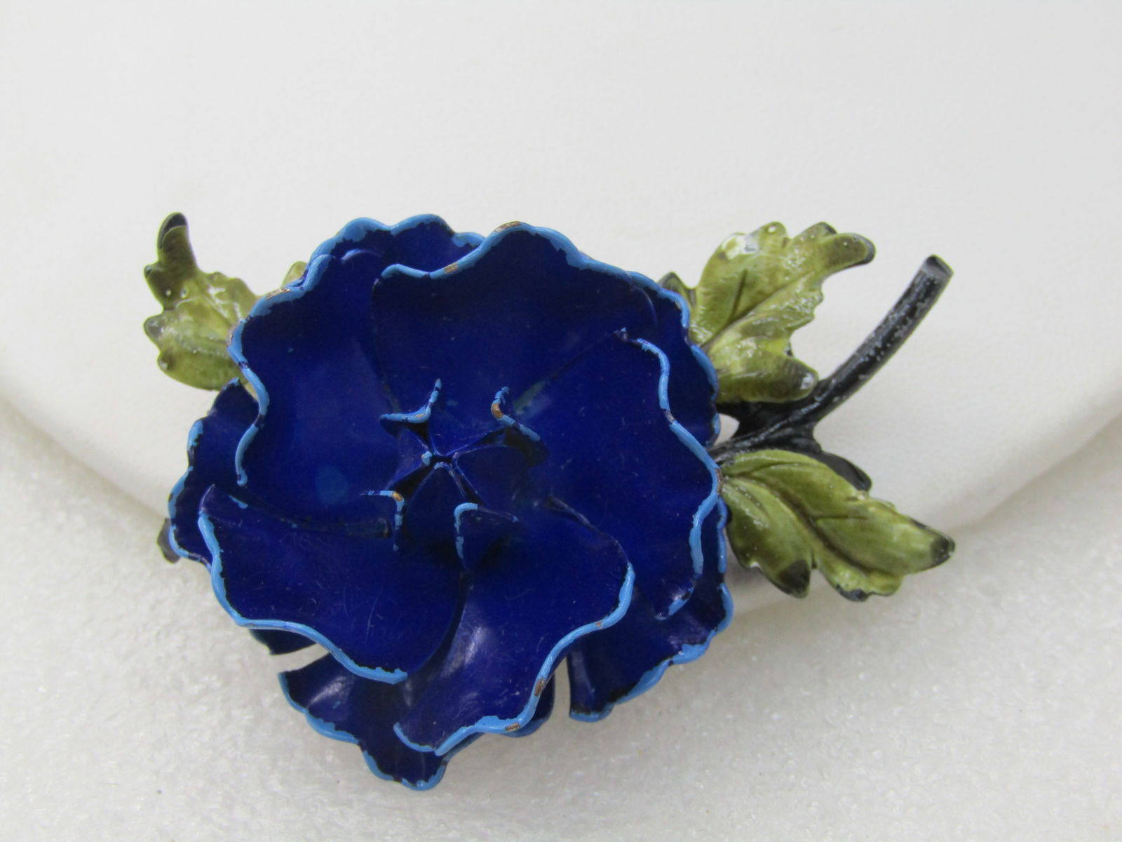 Vintage Coro Blue Carnation Brooch with Leaves, 2.5", 1950's-1960's: Vintage Coro Blue Carnation Brooch with Leaves, 2.5" by 1.5", 1950's-1960's. Dark blue with two layers of petals with ligher blue edging and a raised closed center and shaded green enameled leaves wit