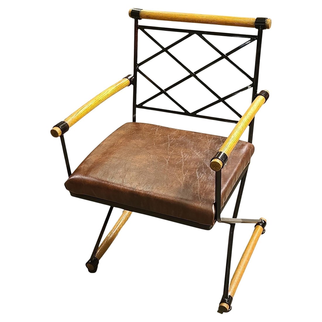 Cleo Baldon Style X-Form Arm Directors Dining Chair, Circa 1970: Handcrafted wrought iron chair is known as the "Directors Chair" in the style of Cleo Baldon for Terra from the early 1960s. This chair features a wrought iron frame with oakwood poles along the base