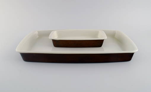 Stig Lindberg for Gustavsberg. Two Coq serving dishes in glazed stoneware. Beautiful glaze in brown: Stig Lindberg for Gustavsberg. Two Coq serving dishes in glazed stoneware. Beautiful glaze in brown shades. Swedish design, 1960s. Largest measures: 43 x 25 x 4.4 cm. In excellent condition. Stamped.