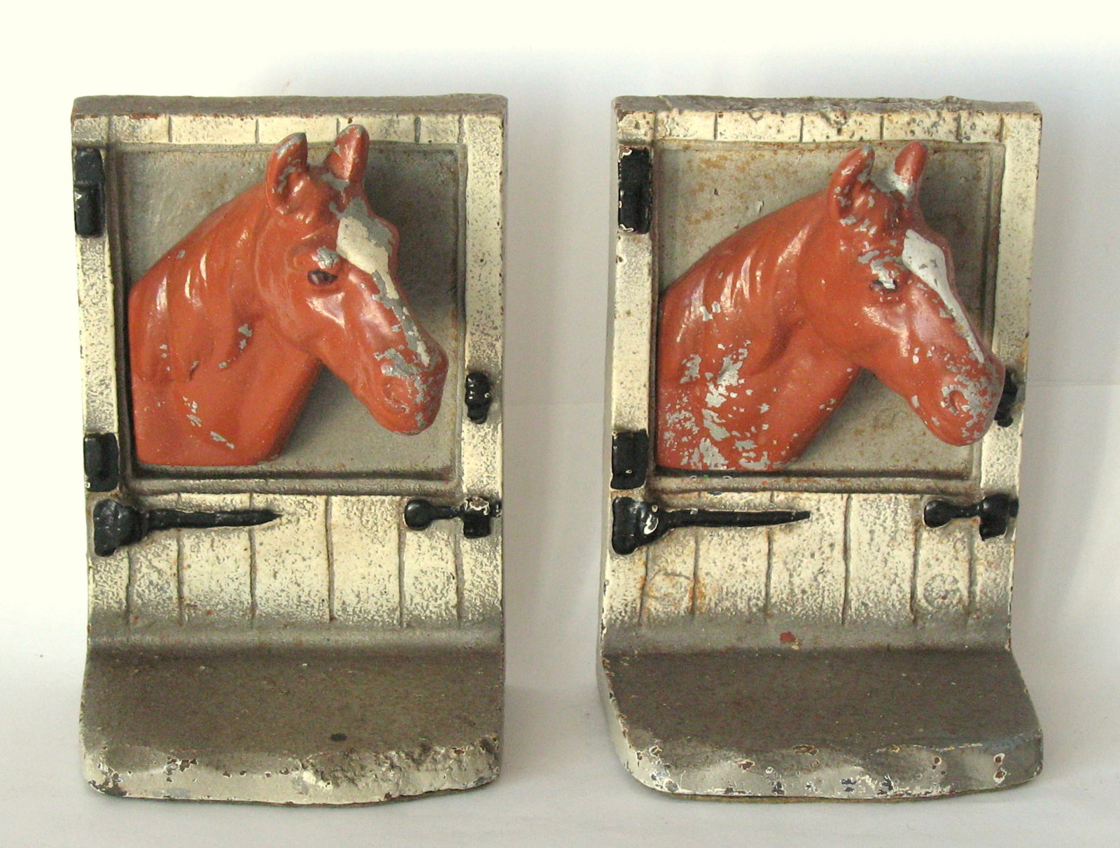 Antique cast iron Horse at the Stable Door bookends.: Title: Antique cast iron Horse at the Stable Door bookends. Date/Period: 1930's Dimension: 3 1/4” x 5” high Additional Information: Nice pair of antique cast iron Horse at the Stable Door 