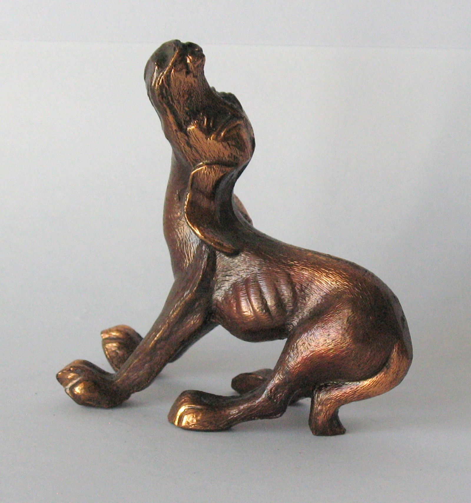 Vintage cast brass howling hound dog figure. (1 of 4)