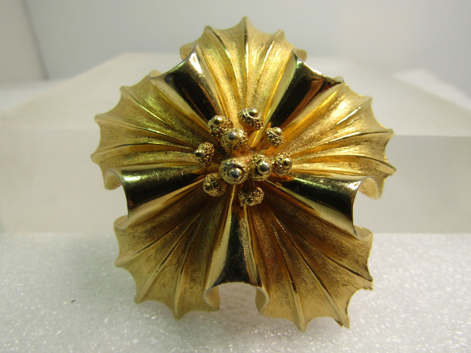 Vintage Floral Domed Brooch, Signed Coro, 2", 1960's: Vintage Floral Domed Brooch, Signed Coro, 2", 1960's, This is gold tone with smooth and shiny and textured finish with a textured raised cluster of anthers. The brooch has raised smooth and shiny curv