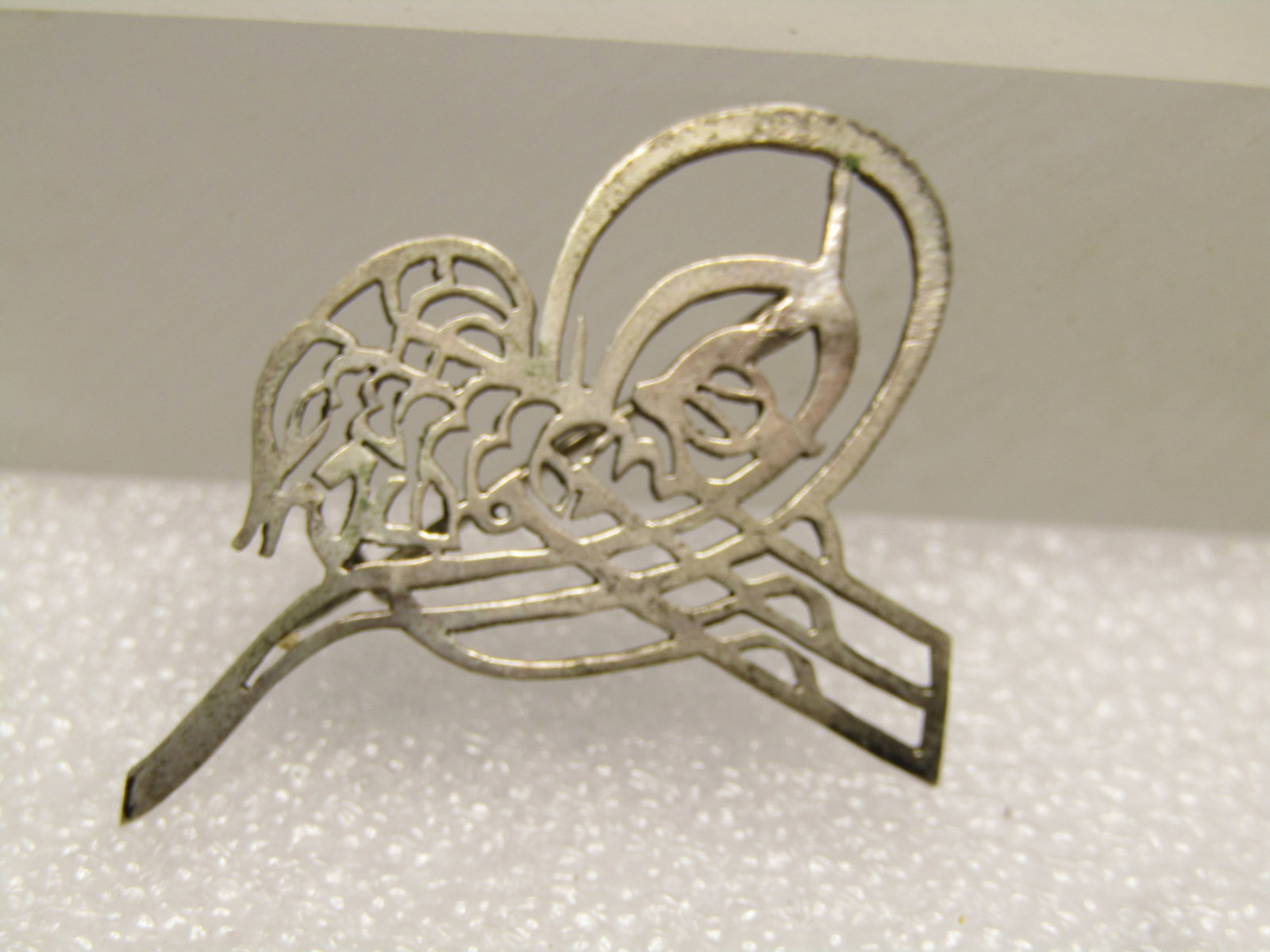 Vintage .800 Silver Scrolled brooch, 1940's-1950's: Vintage .800 Silver Scrolled brooch, 1940's-1950's.. It is an open filigree and scrolled design that is appx. 1.25" wide and 1" tall. It is marked .800 on the back and tests as silver with an appx. we