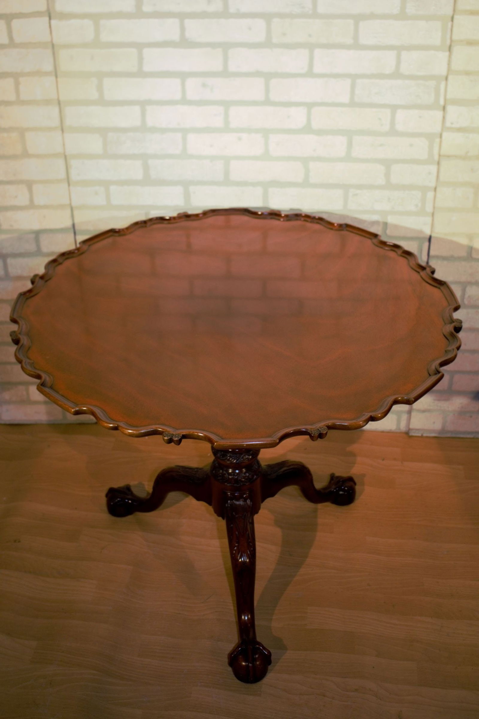 Vintage Chippendale Pie Crust Tilt Top Philadelphia Rococo Tea Table by Kindel Furniture Co.: Materials: wood, mahogany, brass, metal Vintage Kindel Furniture Co. Chippendale Mahogany Pie Crust Tilt Top Philadelphia Rococo Tea Table Gorgeous Chippendale Tilt-Top Intricately Carved Flame Mahoga