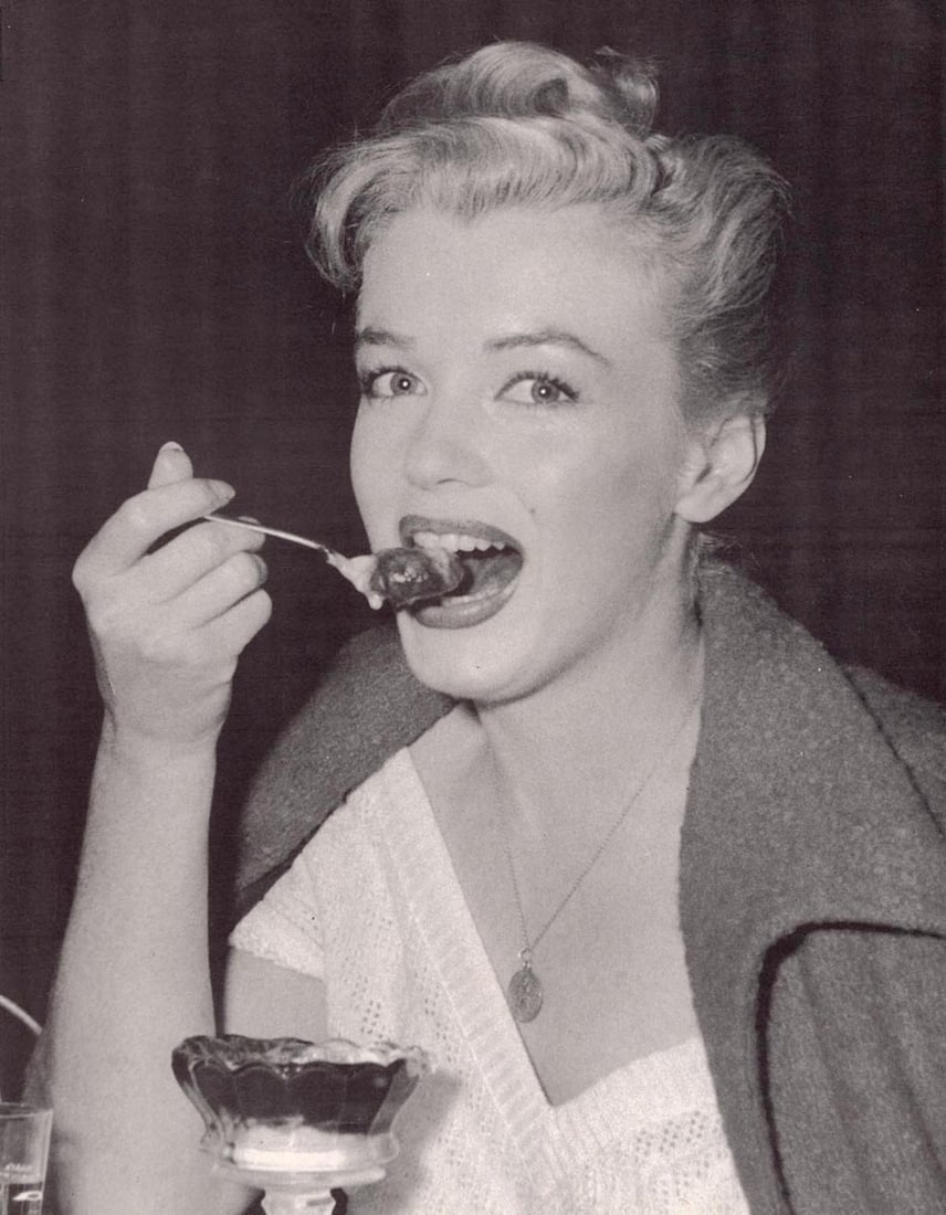 ANDRE DE DIENES - Marilyn Monroe (Norma Jean) (with ice cream): Artist: ANDRE DE DIENES Print Title: Marilyn Monroe (Norma Jean) Medium: Photo-lithograph Printed 1980’s in the USA Image size (inches) approx. 12 x 9” Andre De Dienes De Dienes was a prof