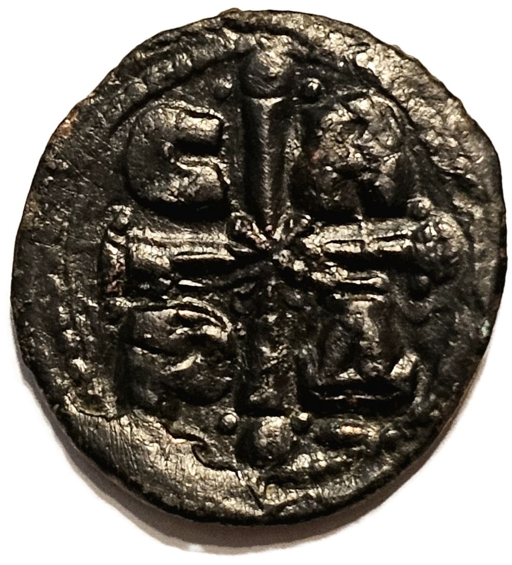 Byzantine Romanos IV AE Follis: Obv: Bust of Christ from front. Obv: Cross cantoned by C-R/P-^ Date/Period: 1068-1071 AD Material: Bronze Dimensions: 8.13g 26.2mm Reserve: $30.00 Shipping: Domestic: Flat-rate of $10.00 to anywh
