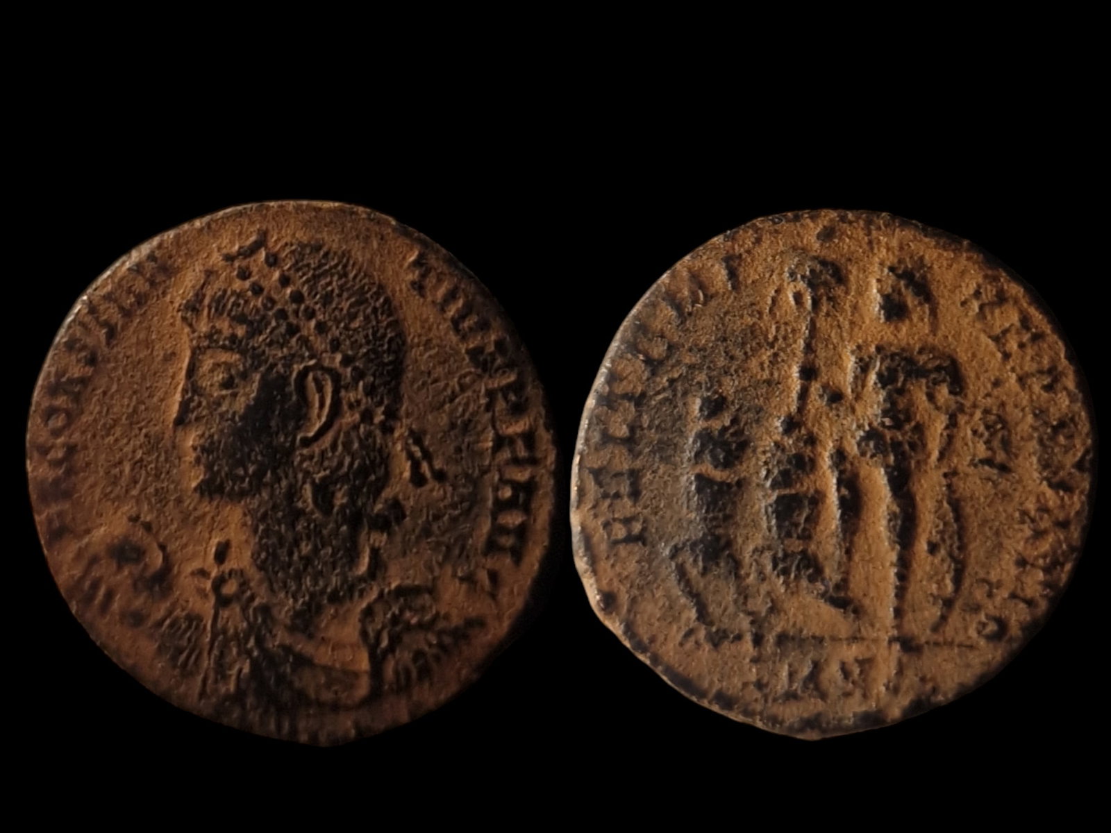 Roman Empire: Constantius II, 348-350 AD. Obverse: Bust of Constantius II left, holding globe. Inscription: "D N CONSTANTIVS P F AVG." Reverse: Constantius II in military dress, holding labarum and shield, with two