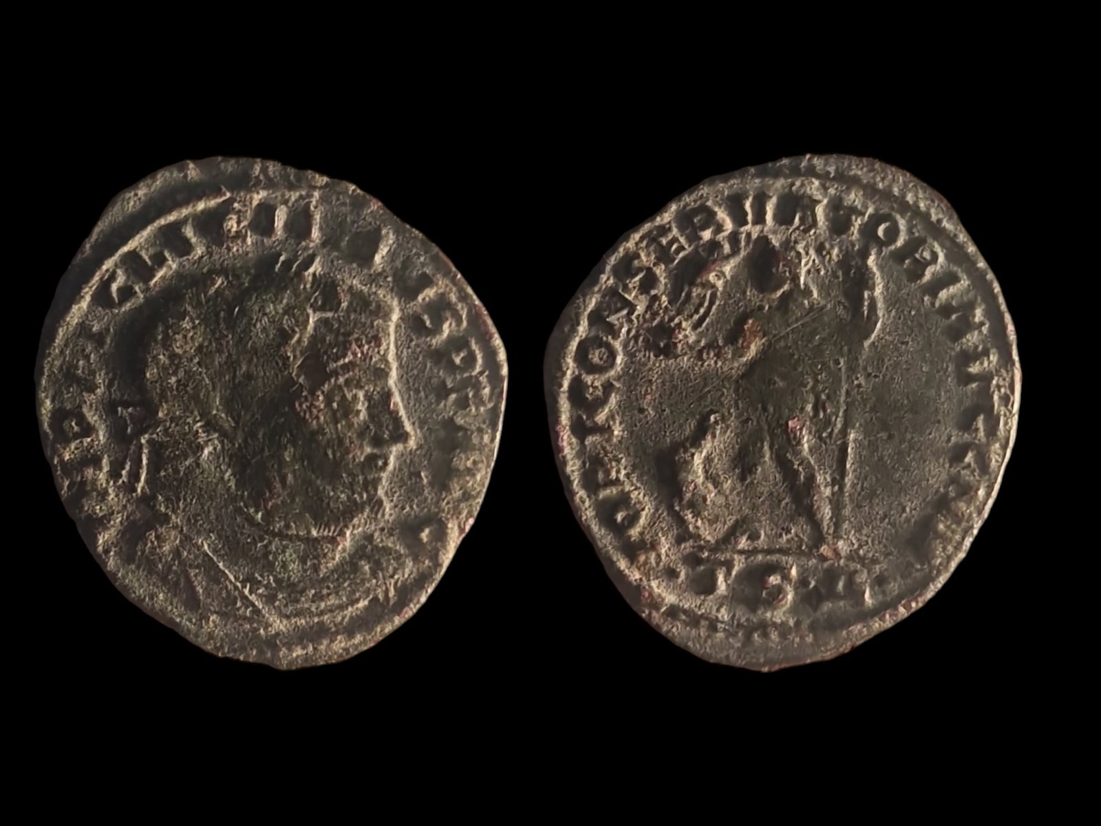 Roman Empire: Ancient Coin: Roman Bronze Coin – Honorius AE2 (392-395 AD) Obverse: The bust of Emperor Honorius facing right with the inscription "DN HONORIVS PF AVG." Reverse: Honorius standing, holding a st