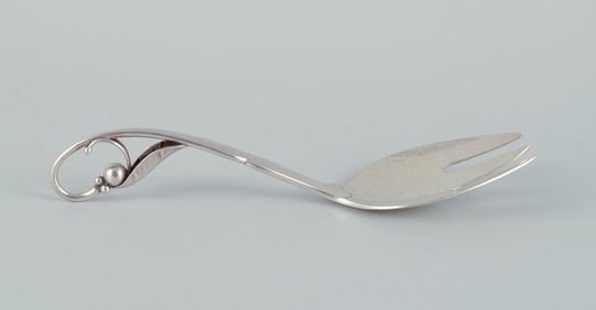 Georg Jensen serving-fork with openwork foliage. Sterling silver.