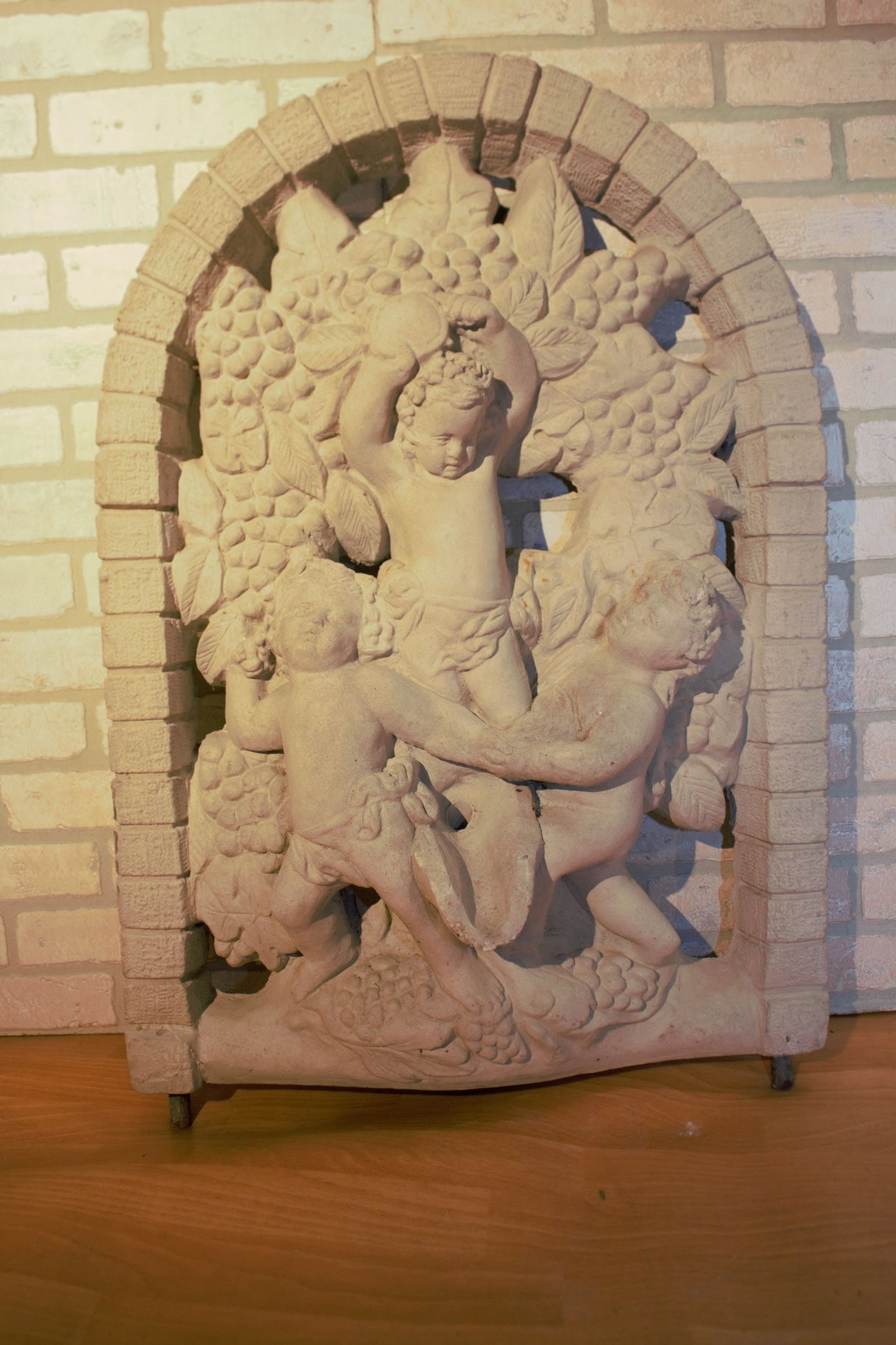 Vintage Arched Cherub Wine Harvest Wall Plaque Wall Decor Indoor Outdoor: Vintage from the 1930s Materials: concrete Width: 24 inches Height: 34 inches Depth: 4 feet Antique Arched Cherub Wine Harvest Wall Plaque A beautiful piece to add to your garden. Circa 1930 Dimension
