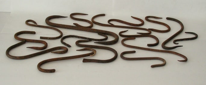 Group of antique metal meat hooks