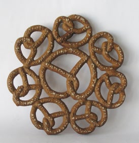 Vintage cast metal Lititz, PA pretzel trivet