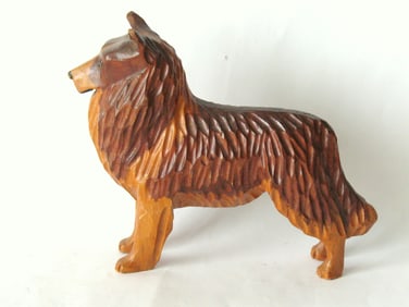 Antique folk art wood carving of a Collie dog.
