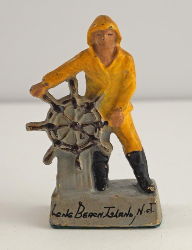 Gloucester Whaler Cast Metal Nautical Paperweight: Title: Gloucester Whaler Cast Metal Nautical Paperweight Dimension: 3 ½” tall x 1 7/8” wide. Date: Ca. 1940’s-50’s. Additional Information: Full-figure Gloucester Whaler, 