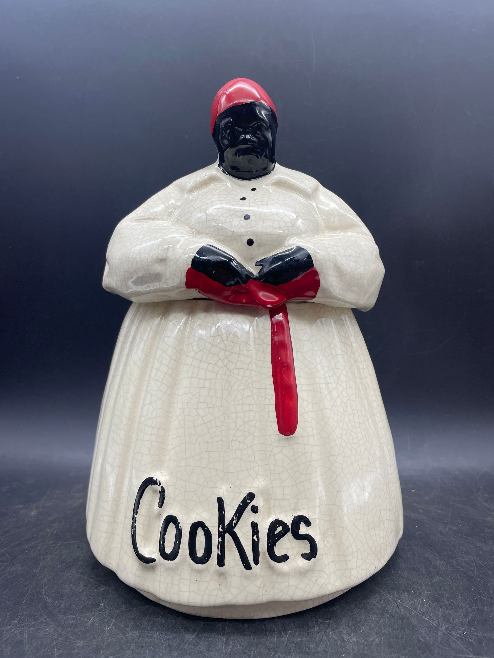 Vintage McCoy Black Americana Mammy Cookie Jar: Title: Vintage McCoy Black Americana Mammy Cookie Jar Date/Period: unknown Dimension: Approx 11 x 7 Material: ceramic Additional Information: McCoy Mammy Cookie Jar, the figural cookie jar labeled 'Co