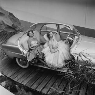 Simca Aronde ' By Thurston Hopkins Oversized Resin: Description ' Simca Aronde ' by Thurston Hopkins 1st October 1956: Two models posing in a cutaway Simca Aronde at the Paris Motor Show. Original Publication: Picture Post - 8714 - Cars For 1957 - pub.