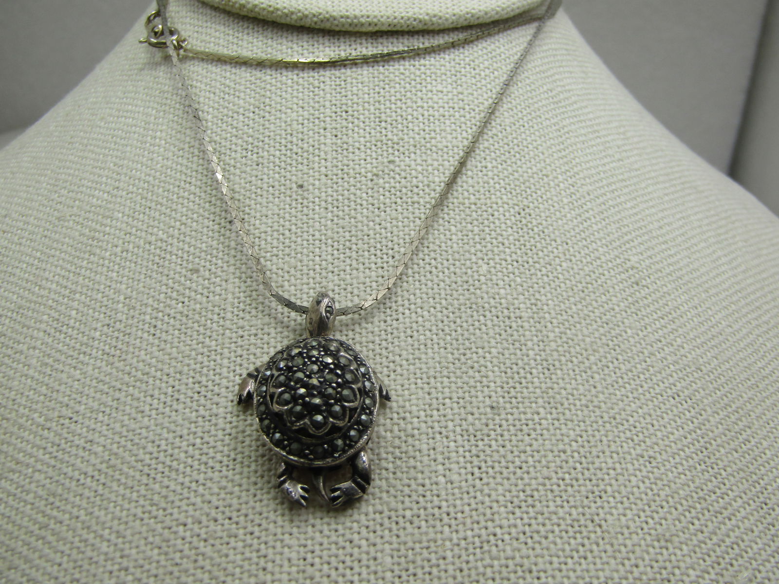 Vintage Sterling Articulated Marcasite Turtle Pendant on 24" Chain: Vintage Sterling Articulated Marcasite Turtle Pendant on 24" Chain. The turtle tests as sterling and is appx. 6.43 gr. The chain is not sterling but a 1.5mm square link with spring clasp and marked Ko
