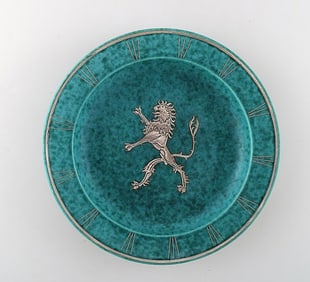 Wilhelm Kåge, Gustavsberg, art deco Argenta dish on feet in ceramics decorated with lion in