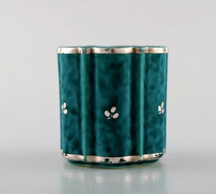 Wilhelm Kåge for Gustavsberg. Argenta vase in ceramics decorated with leaves in silver inlaid.