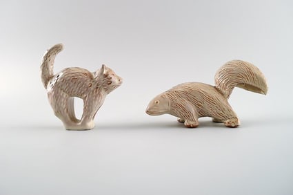 Höganäs, two pottery figurines, cat and skunk. Swedish design.
