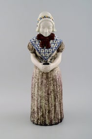 Michael Andersen Ceramics from Bornholm. Large figure of woman with Songbook in national dress. No.